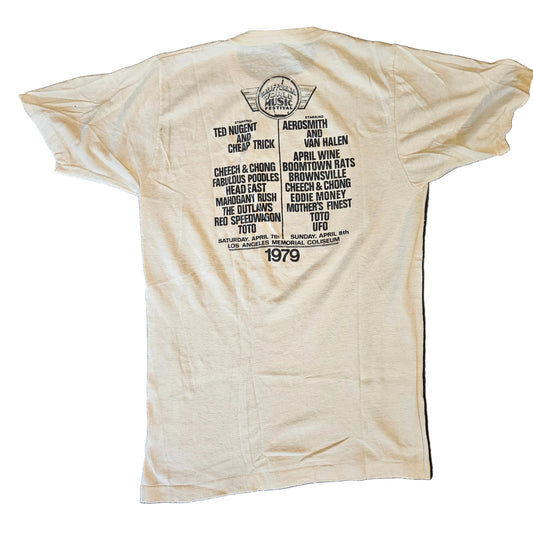 Back of California World Music Festival 1979 tee showing full artist lineup including Van Halen, Aerosmith, Ted Nugent, Cheap Trick, REO Speedwagon and more, Los Angeles Memorial Coliseum April 7-8 1979