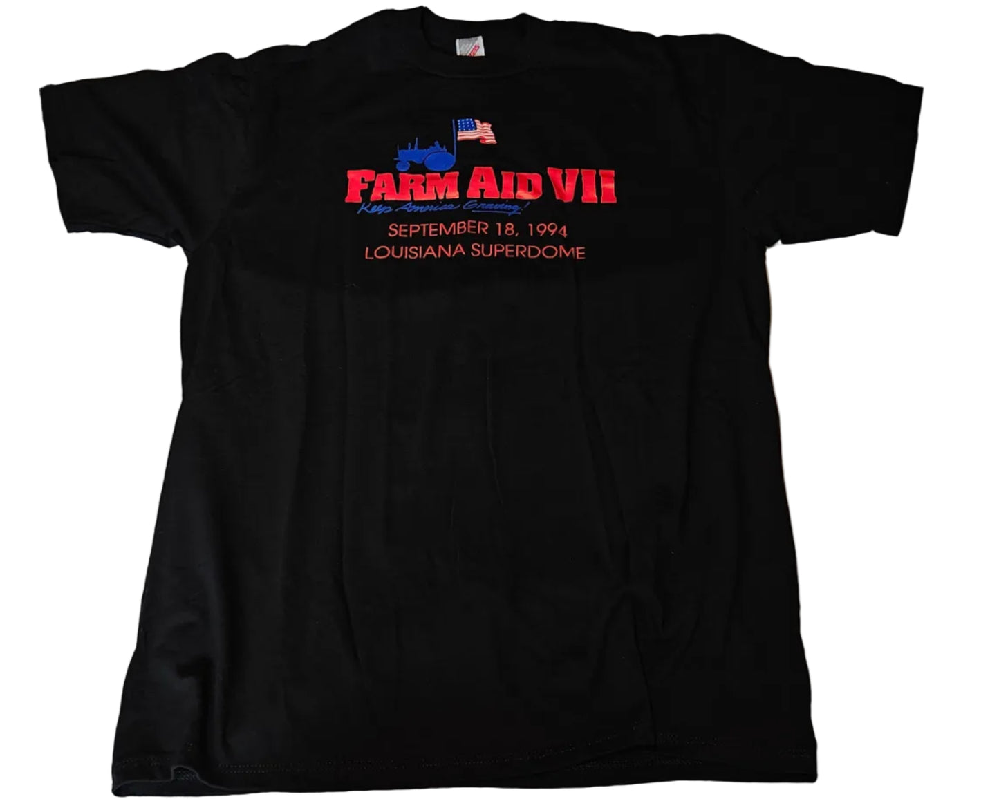 Black Farm Aid VII tee with red and blue logo reading Farm Aid VII September 18 1994 Louisiana Superdome, size XL, unworn