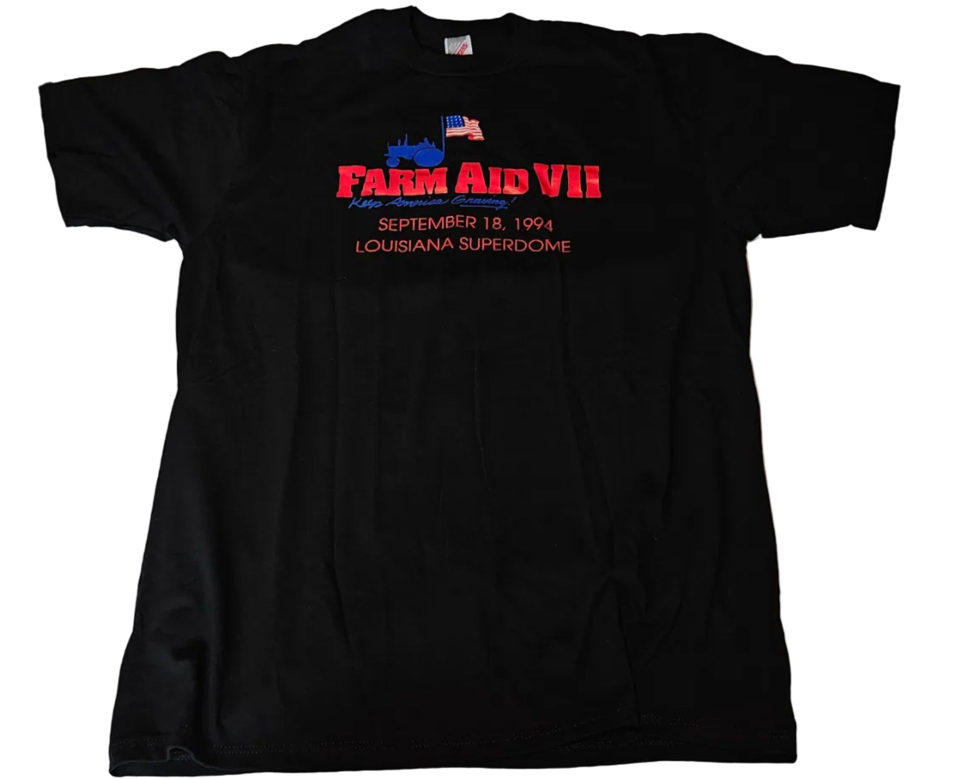 Black Farm Aid VII tee with red and blue logo reading Farm Aid VII September 18 1994 Louisiana Superdome, size XL, unworn