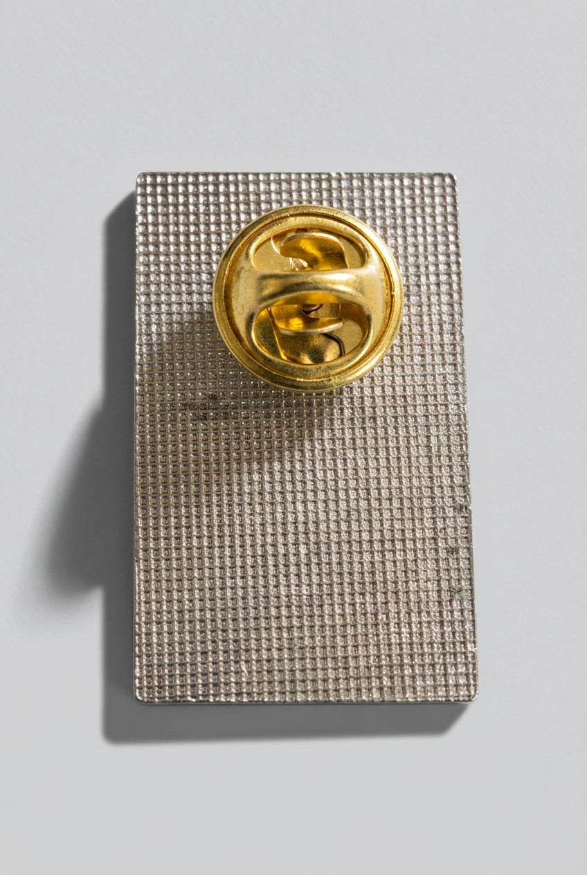 Santana winged figure enamel pin from Bruce Jones’s collection, back