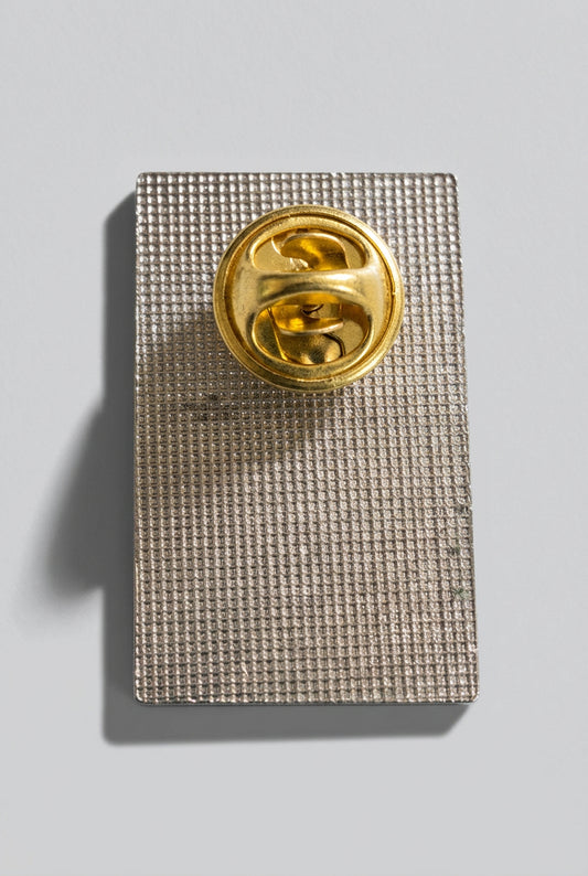 Santana winged figure enamel pin from Bruce Jones’s collection, back